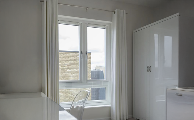Eumax uPVC combination window showing fixed panel combined with sliding section in a single multi-chamber uPVC frame
